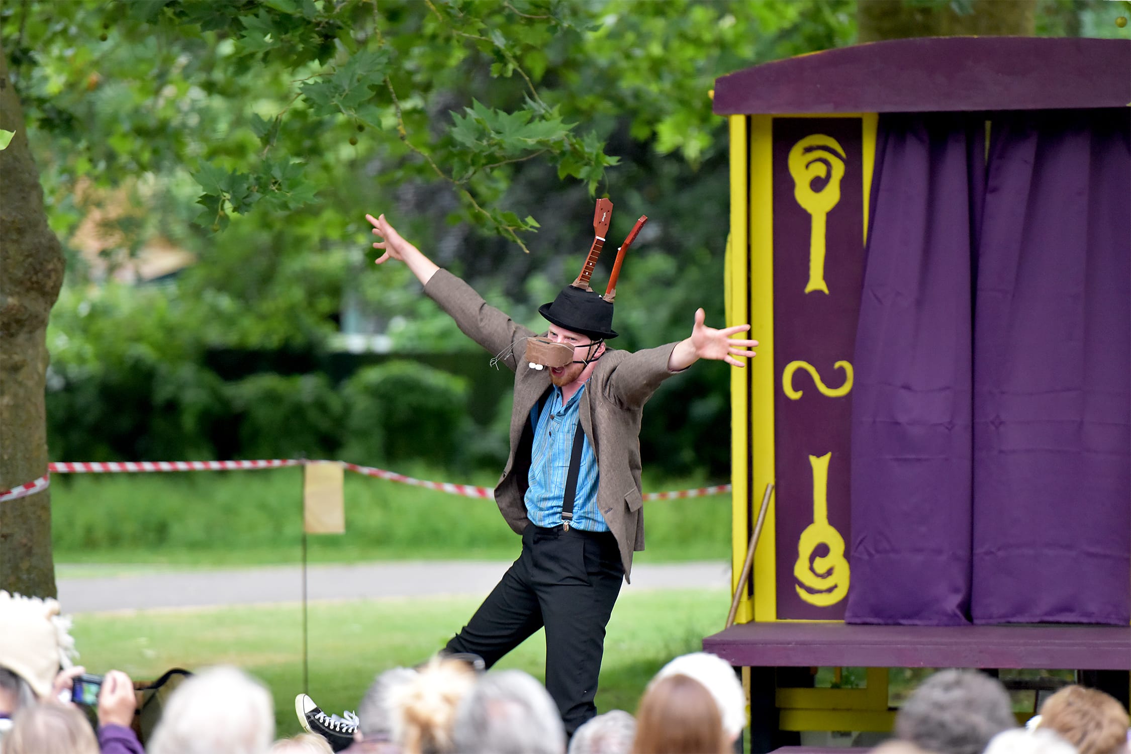 An outdoor theatre group performs a midsummer nights dream at Llanthony Secunda Priory