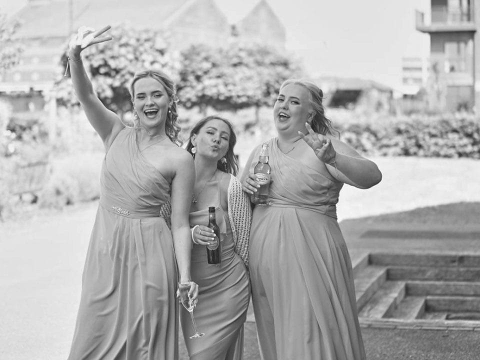 3 Bridesmaids pose to camera