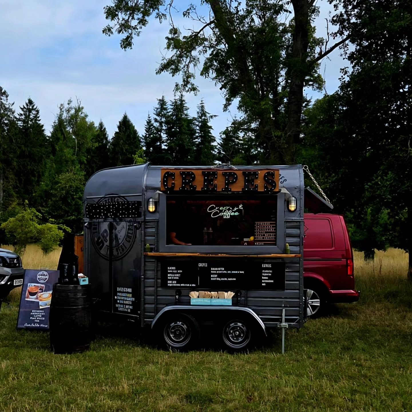 Horsebox trailer that has been converted into a coffee bar. It's dark grey